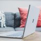 macbook pro on white couch